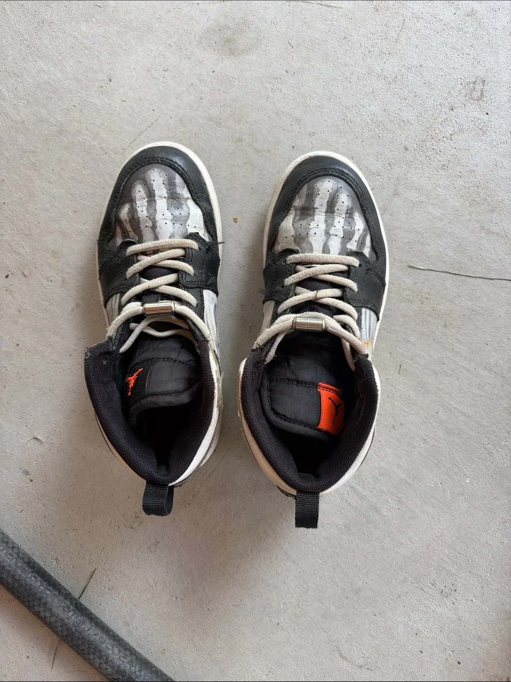 Nike Kids Black and White High-Top Sneakers with Orange Logo